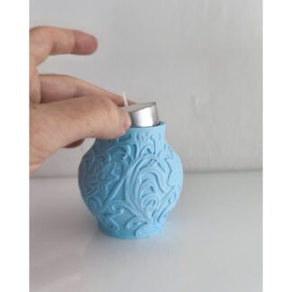 Decorative rounded candle holder with an ornate raised pattern