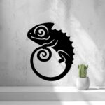 Black chameleon silhouette wall art displayed on a light textured wall