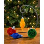 Ribbed round and elongated Christmas ornaments in a festive display