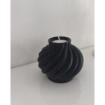 Rounded decorative candle holder with sweeping spiral ridges