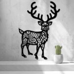 Reindeer silhouette wall art with sweeping antlers and ornate cutout patterns